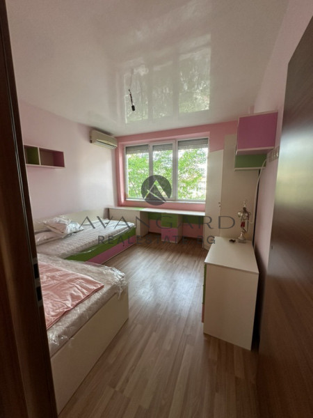 A two -bedroom apartment with a garage and a parking space