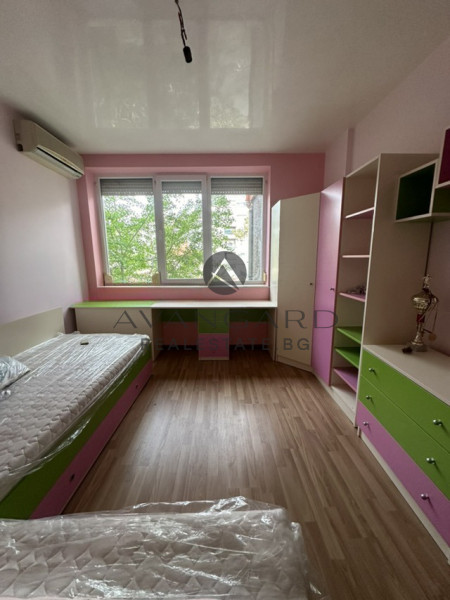 A two -bedroom apartment with a garage and a parking space