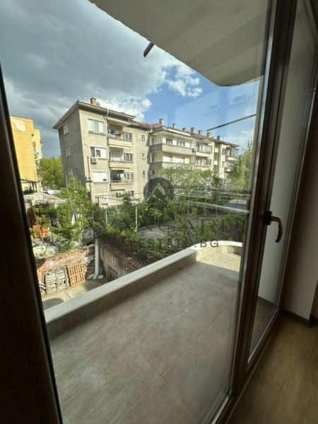 A two -bedroom apartment with a garage and a parking space