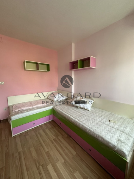 A two -bedroom apartment with a garage and a parking space